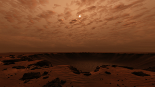 Relaxing PC games — In Take On Mars, sunlight drifts through the dusty Martian atmosphere over the red sprawl of a meteor crater.