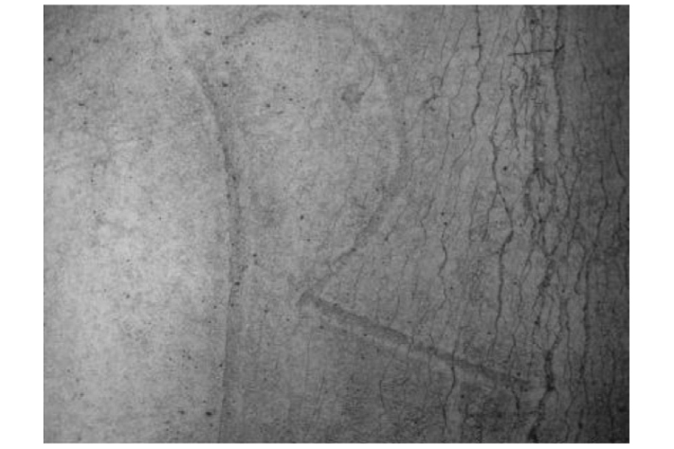 The letter "R" as seen through a scanning electron microscope.