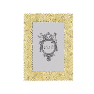 A rectangular gold photo frame with ornate detailing and crystals around the border and a gray center