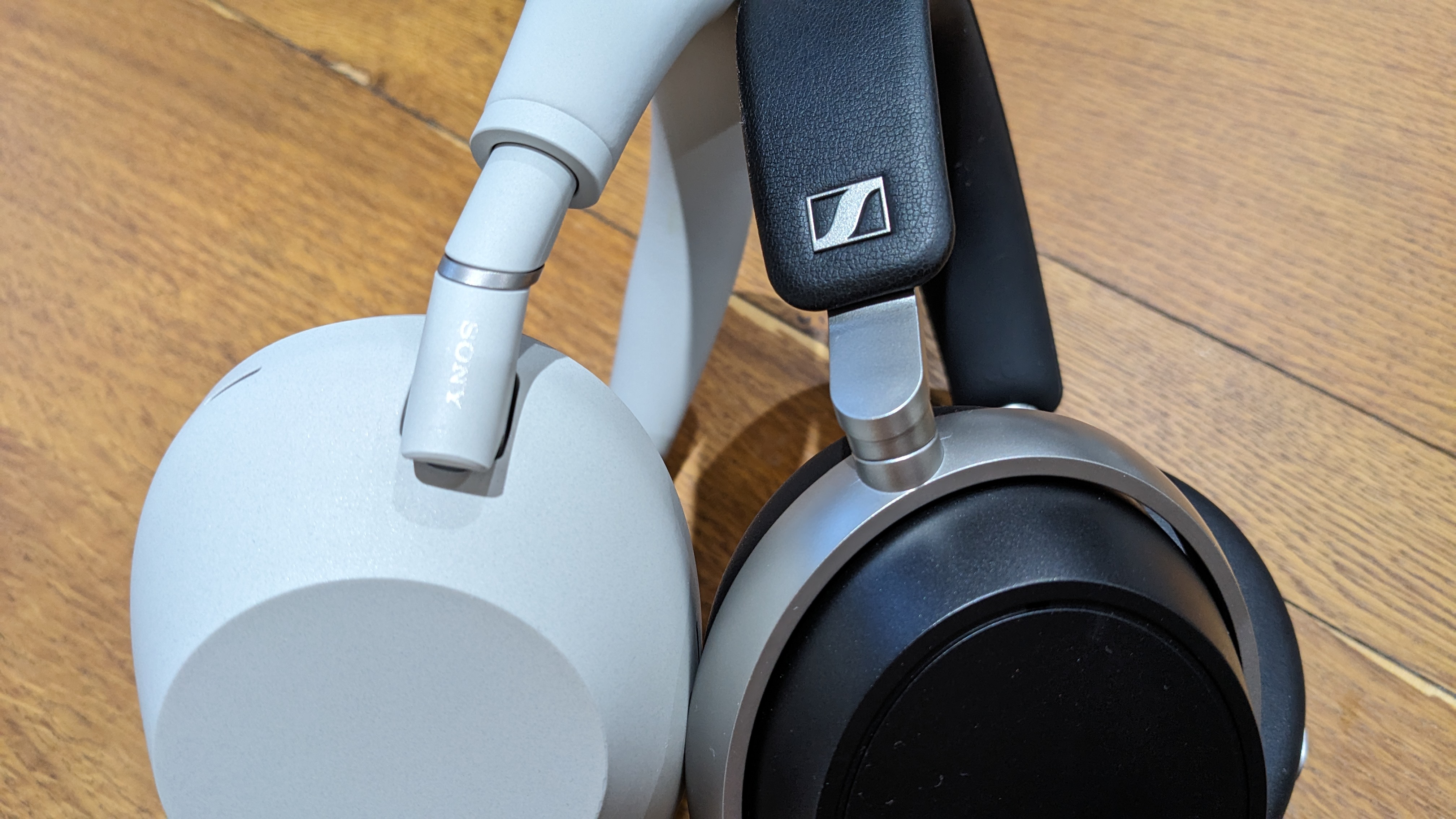 Close-up of Sennheiser HDB 630 and Sony XM6 hinge design