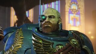 Warhammer 40,000: Space Marine 2 trailer still - close-up of a bald, bearded space marine wearing a cyber-monocle