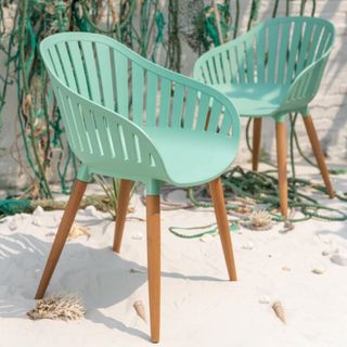 mint green garden chair with wooden legs