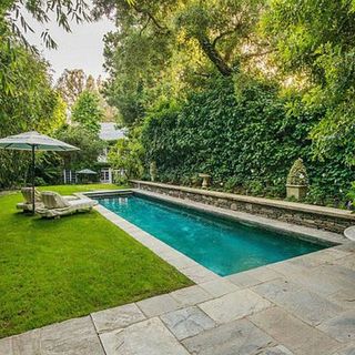 Swimming pool, Garden, Aqua, Shade, Rectangle, Composite material, Turquoise, Shrub, Water feature, Tile,