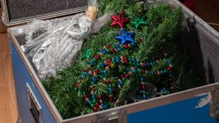 A Christmas tree stored in a trunk