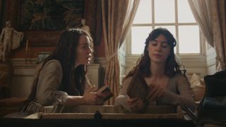 Esme Creed-Miles looking at Daisy Edgar Jones in Sense and Sensibility. 