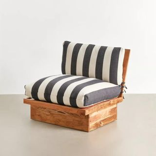 A outdoor single sofa with a wooden base and stripey cushions