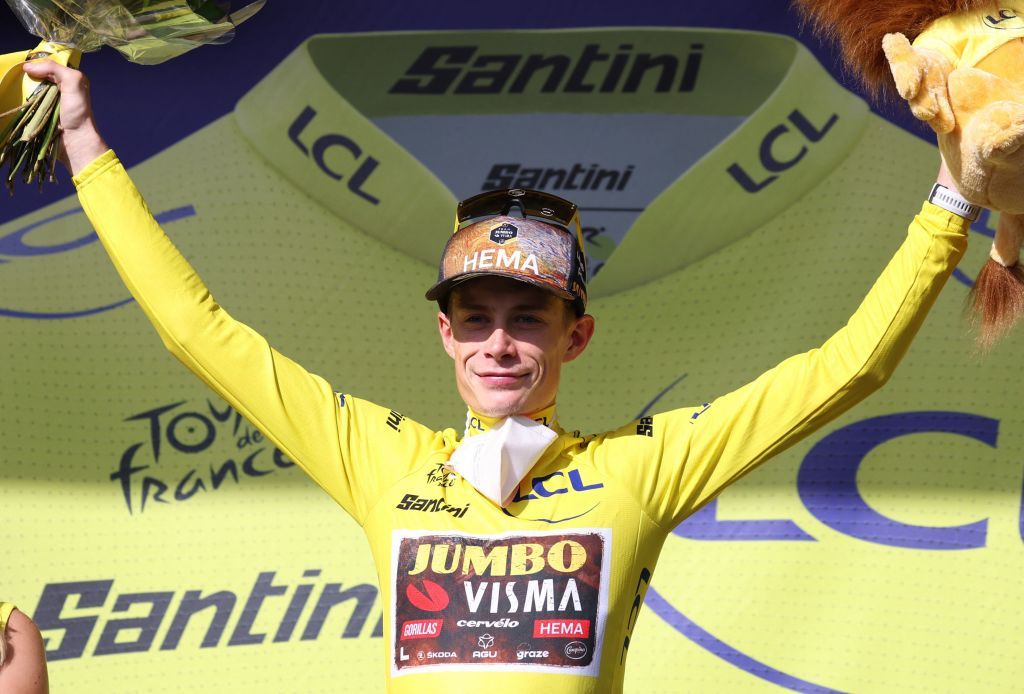 JumboVisma teams Danish rider Jonas Vingegaard celebrates on the podium with the overall leaders yellow jersey after the 13th stage of the 109th edition of the Tour de France cycling race 1926 km between Le Bourg dOisans in The French Alps and SaintEtienne in central France on July 15 2022 Photo by Thomas SAMSON AFP Photo by THOMAS SAMSONAFP via Getty Images