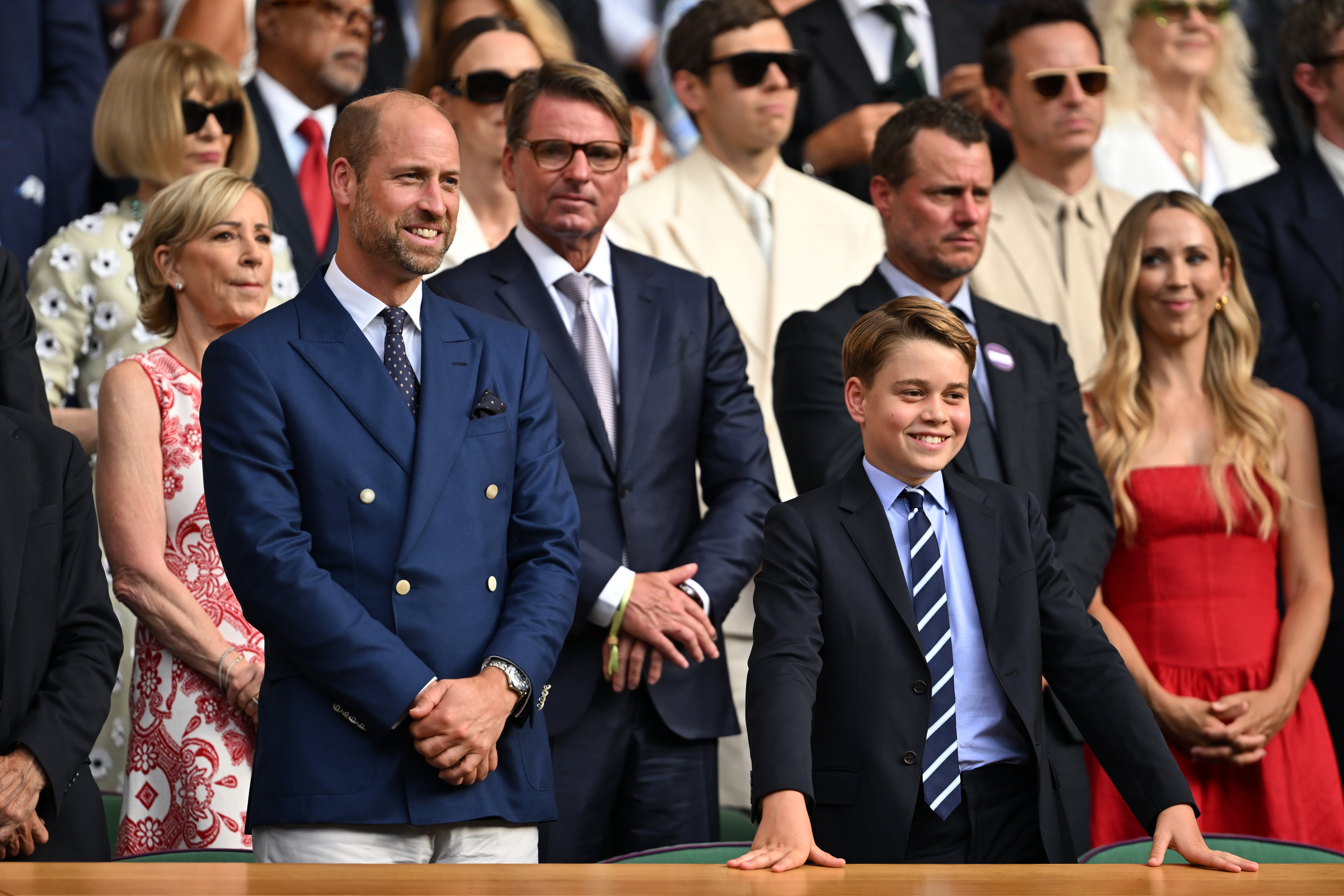 Prince George and Prince William smiling at Wimbledon