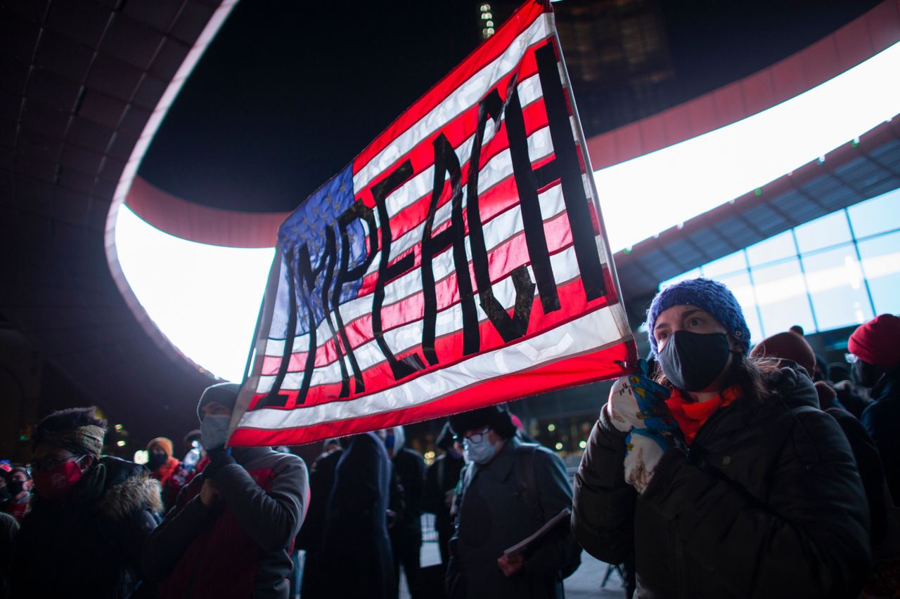 Protesters demand impeachment.