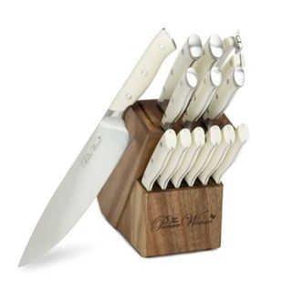 A cream knife set in a wooden block