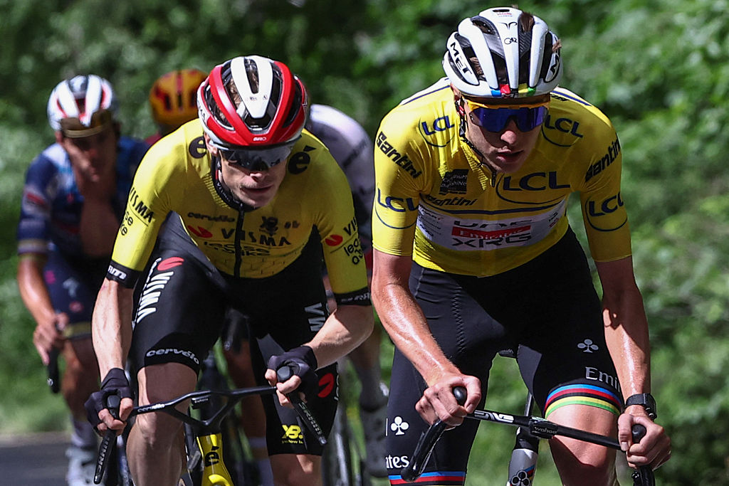 Team Visma - Lease a Bike&#039;s Danish rider Jonas Vingegaard (Centre L) and UAE Team Emirates XRG&#039;s Slovenian rider Tadej Pogaar wearing the overall leader&#039;s yellow jersey cycle during the 7th stage of the 77th edition of the Criterium du Dauphine cycling race, 131,6 km between Grand-Aigueblanche and Valmeinier, on June 14, 2025. (Photo by Anne-Christine POUJOULAT / AFP) (Photo by ANNE-CHRISTINE POUJOULAT/AFP via Getty Images)