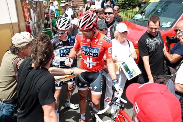 Saxo Bank stars Stuart O'Grady (l) and Fabain Cancellara meet fans before the start.