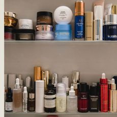 A bathroom cupboard full of skincare products