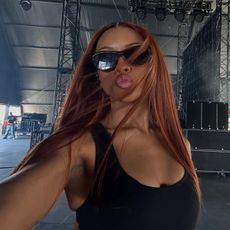 Ravyn Lenae with auburn hair colour