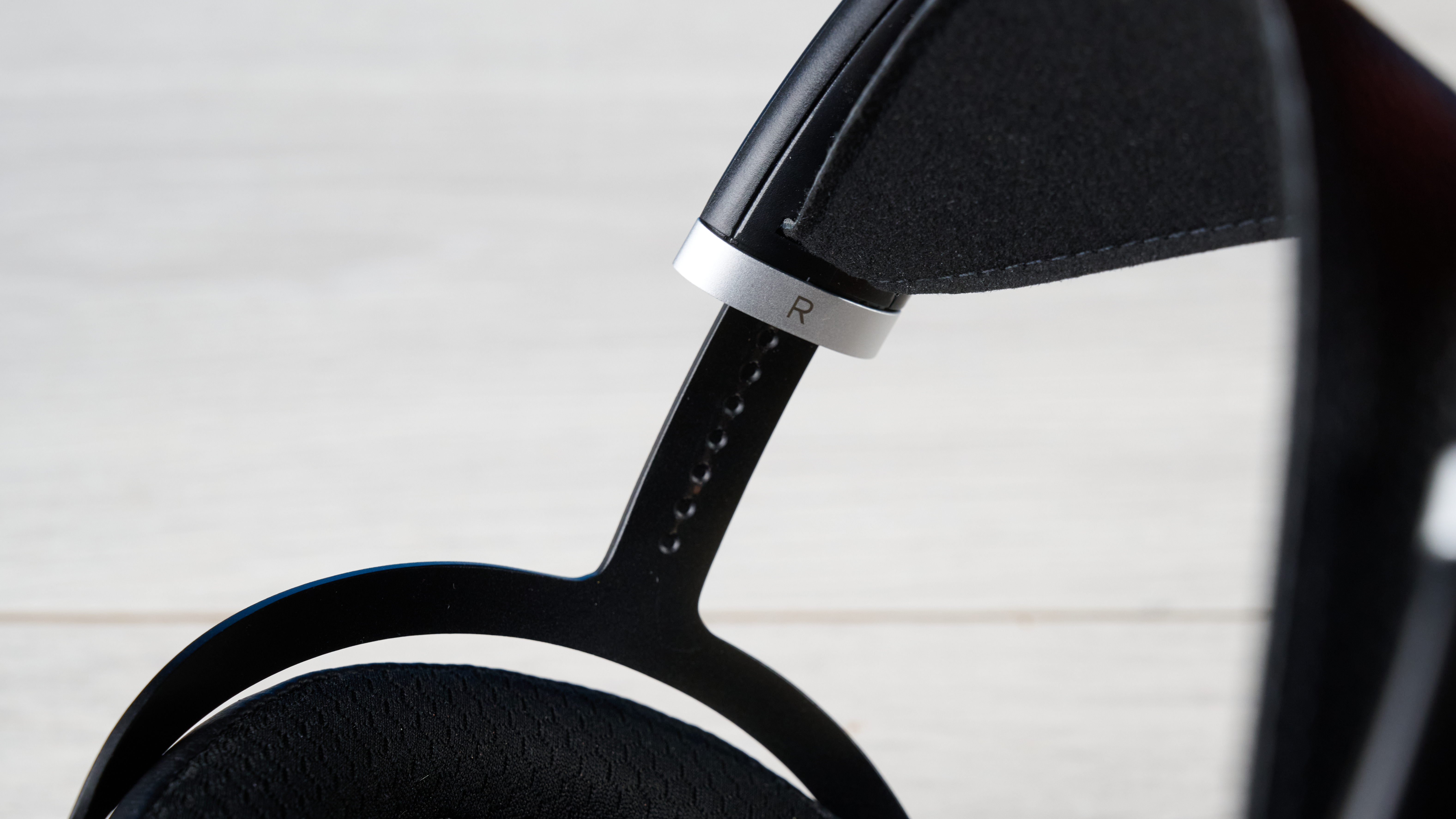 the HIFIMAN Sundara open-back wired audiophile headphones photographed against the blue toms' guide background