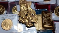 SAN FRANCISCO, CALIFORNIA - OCTOBER 07: In this photo illustration, a one-ounce gold bar, a gold nugget, and gold coins are displayed at Witter Coins on October 07, 2025 in San Francisco, California. Investors pushed the price of gold to $4,000 per ounce for the first time, and it has surged more than 50 percent this year. 