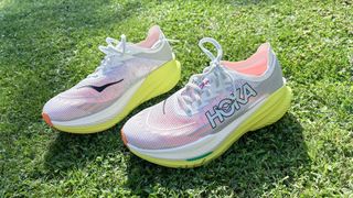 Hoka Mach X2 running shoes on grass in the sunshine