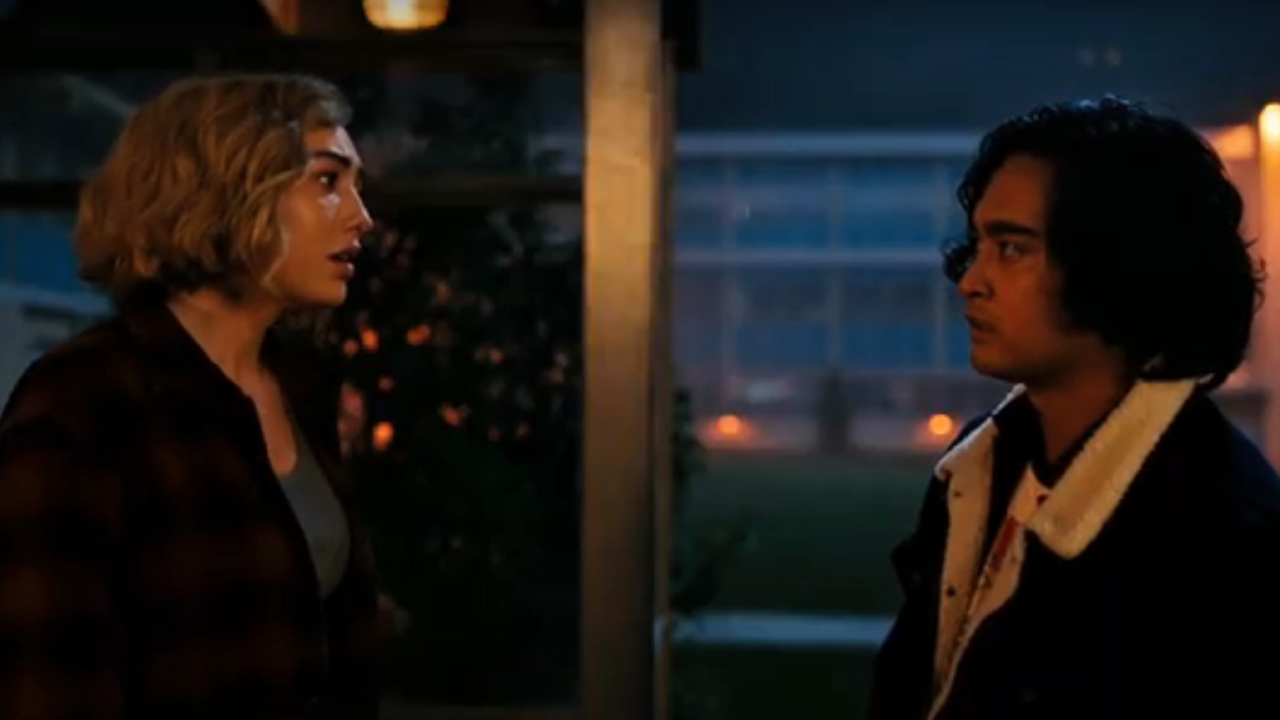 Peyton List and Kristian Ventura standing outside the high school on School Spirits
