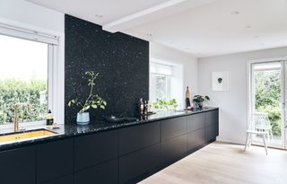 all black modern single line one wall kitchen layout