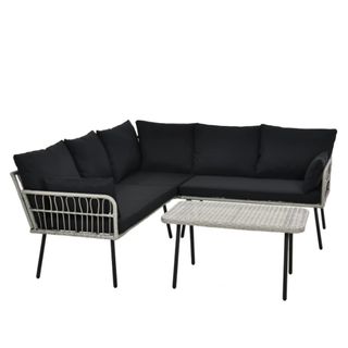 A black L-shaped outdoor couch with a coffee table