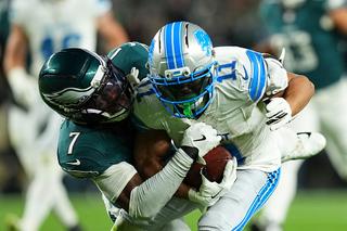 PHILADELPHIA, PENNSYLVANIA - NOVEMBER 16: Kelee Ringo #7 of the Philadelphia Eagles tackles Kalif Raymond #11 of the Detroit Lions at Lincoln Financial Field on November 16, 2025 in Philadelphia, United States. (Photo by Mitchell Leff/Getty Images)