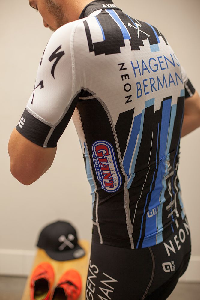 The logo of NEON Adventures is prominently featured across the chest and back of the jersey
