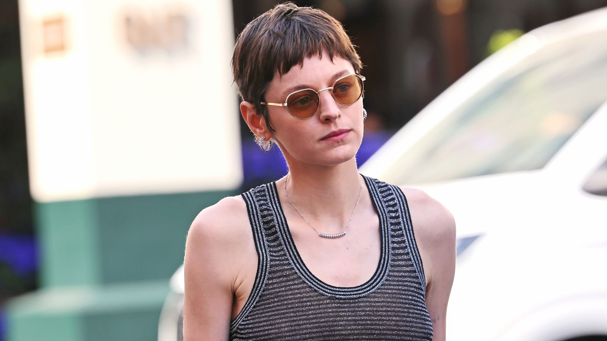 Emma Corrin wears a tank top in Portofino