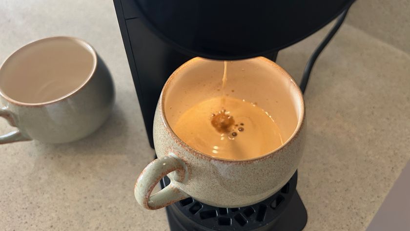 watching the morning coffee maker brew a coffee