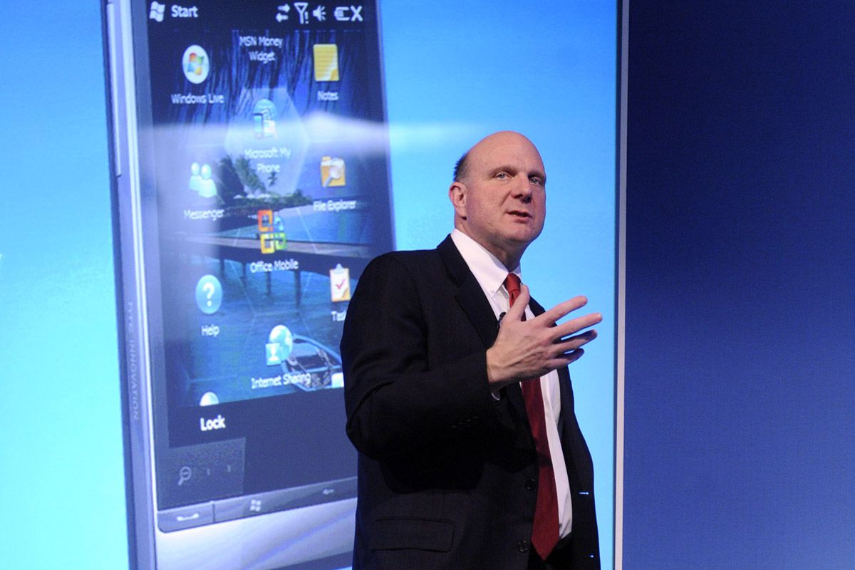 WIndows Phone logo behind Steve Ballmer