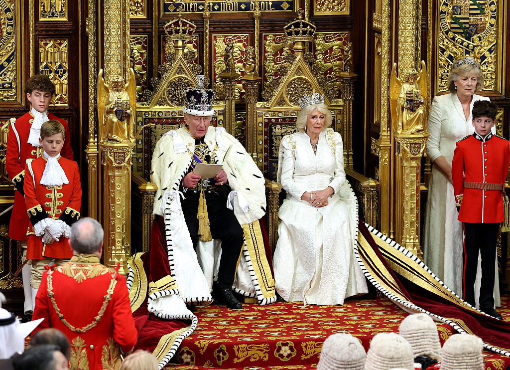 Britain's King Charles III with Britain's Queen Camilla makes his speech in the House of Lords chamber, during the State Opening of Parliament
