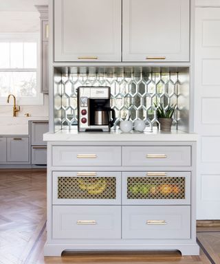 Chic coffee nook with grey cabinets and mirrored backsplash feature.