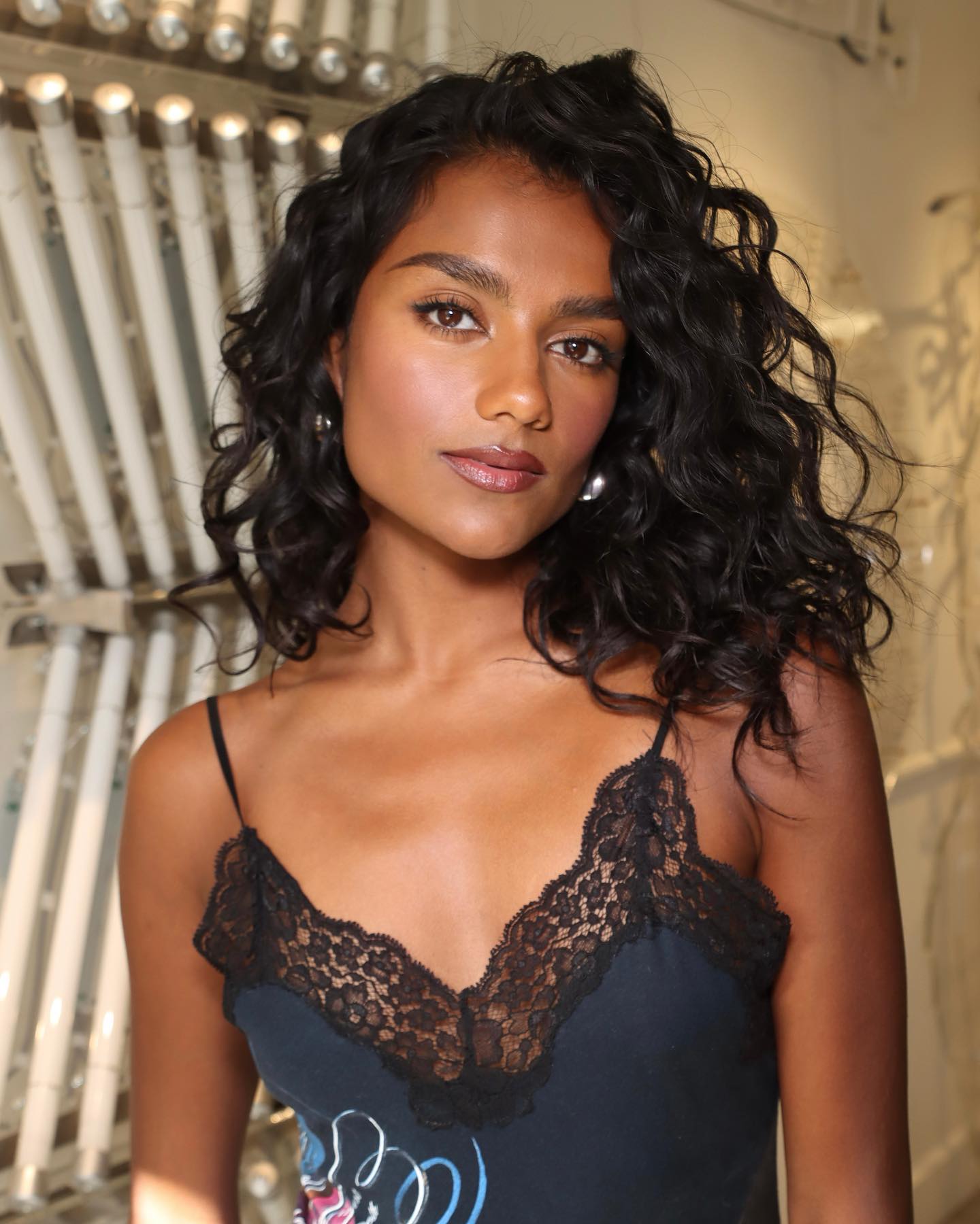 Simone Ashley with mid-length hairstyle