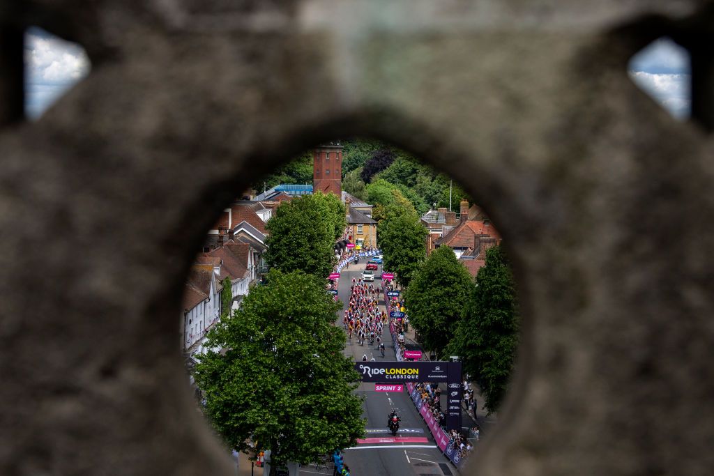 EPPING ENGLAND MAY 28 A general view of the peloton passing down Epping High Street during the 5th RideLondon Classique 2022 Stage 2 a 1417km stage from Chelmsford to Epping RideLondon UCIWWT on May 28 2022 in Epping England Photo by Justin SetterfieldGetty Images
