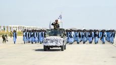 Members of the Taliban take part in a military parade on Aug. 14, 2024, in Bagram, Afghanistan.