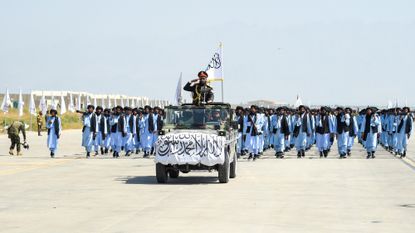 Members of the Taliban take part in a military parade on Aug. 14, 2024, in Bagram, Afghanistan.