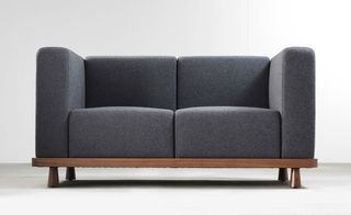 cushion on an elegant wooden frame