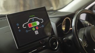 An electric car's dashboard showing a battery charging screen