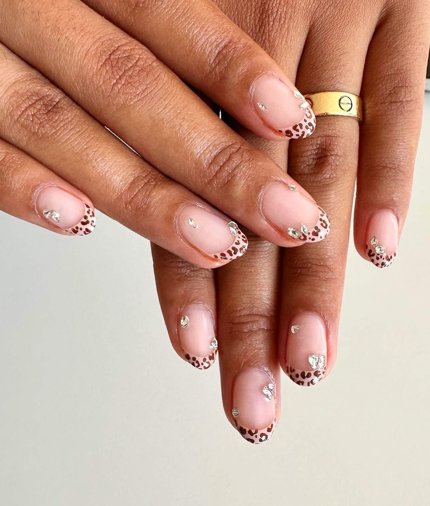 Olivia Dean with leopard print french tips with gemstones