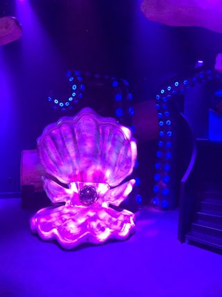 The seashell chair at the CAMP store's Disney The Little Mermaid immersive display.