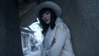 Lera Abova's Miss All-Sunday in her long white coat and white cowboy hat in One Piece