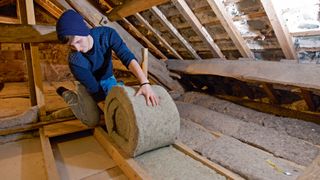 Thermafleece natural insulation is rolled out in the loft