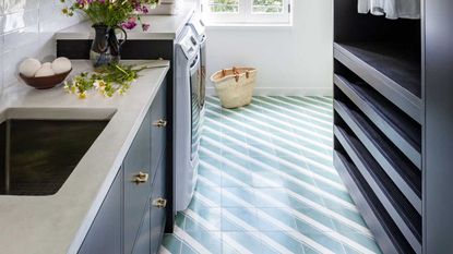 black utility room with green and white striped flooring