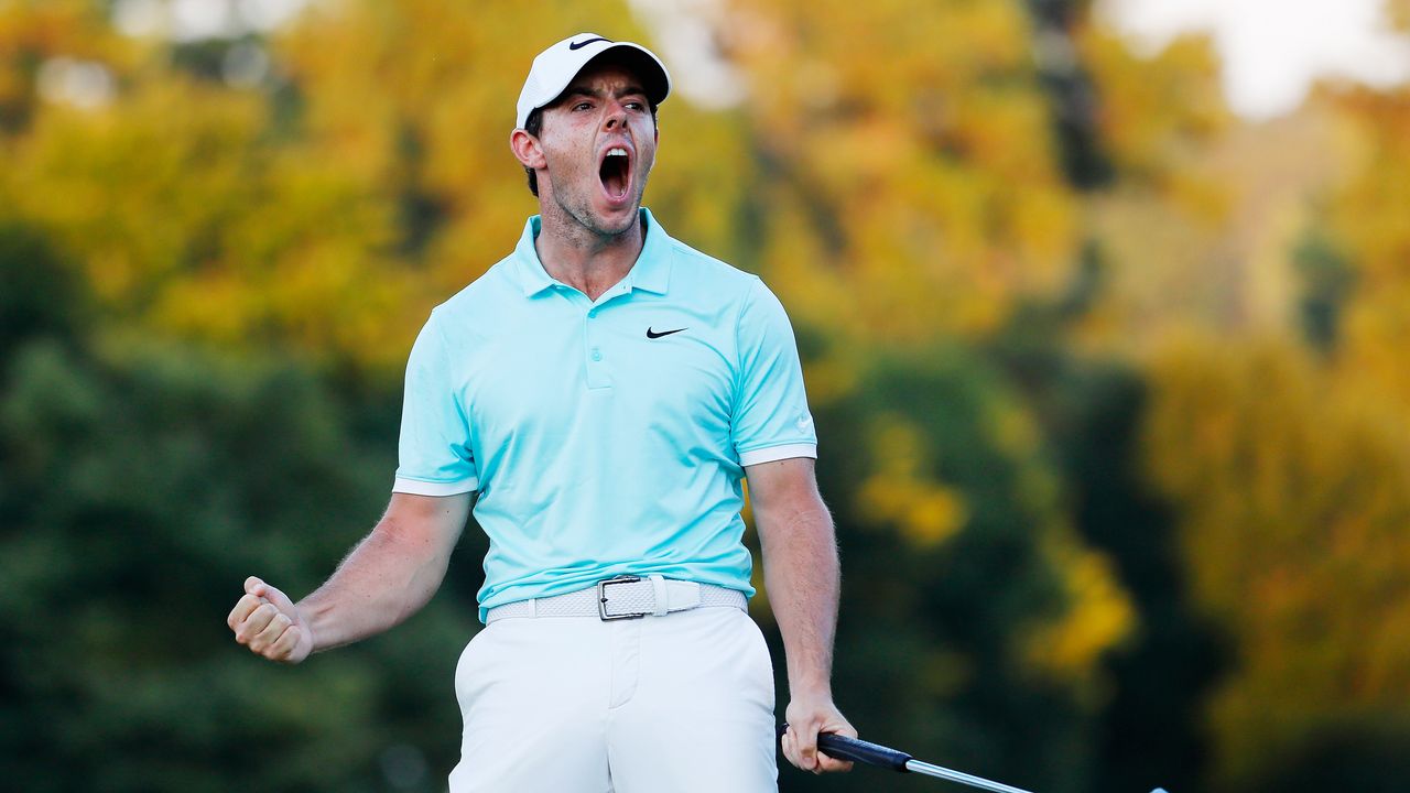 Rory McIlroy celebrates holing a putt