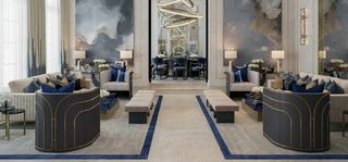 Seating areas with armchairs and sofas in blue and neutral