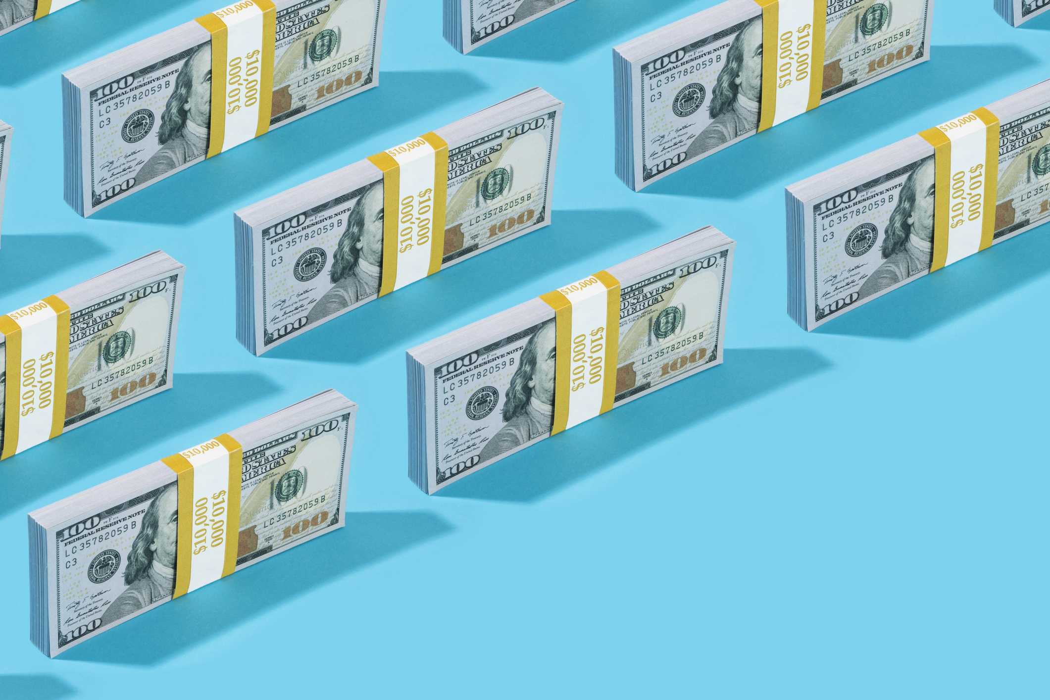 Pattern of one-hundred-dollar bills in the background