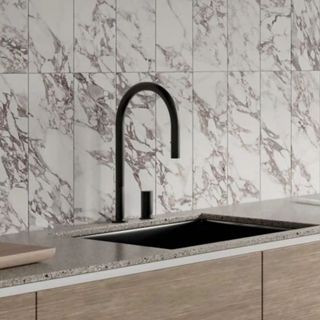 Kitchen sink backsplash with marble effect vertical subway tiles 