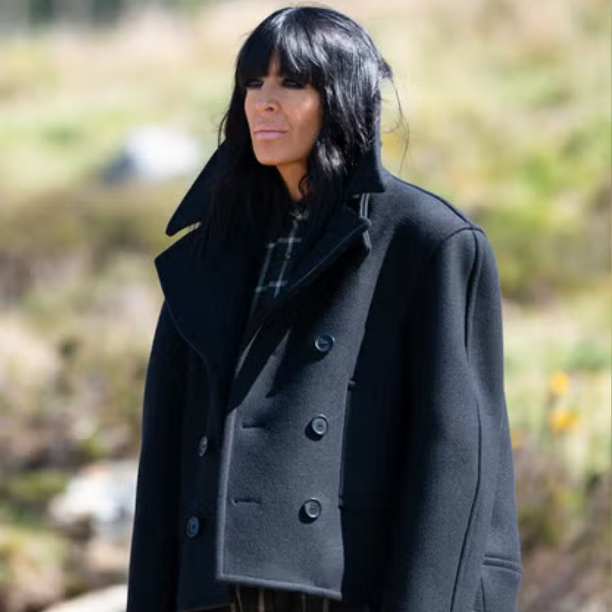 Claudia Winkleman wearing a black pea coat