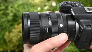 Sigma 17-40mm f/1.8 DC | A product shot held in hand
