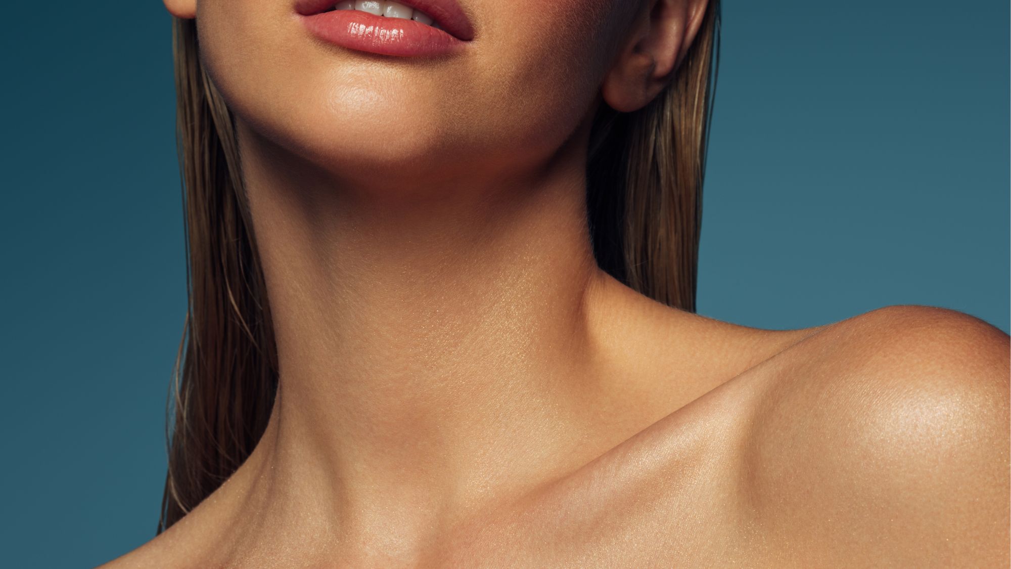 a model shot of shoulders with glossy skin