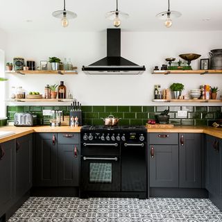 kitchen with grey cabinets and wooden worktop